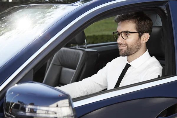 Businessman driving car — Stock Photo, Image