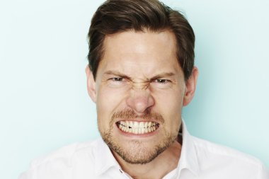 Angry man clenching teeth  clipart