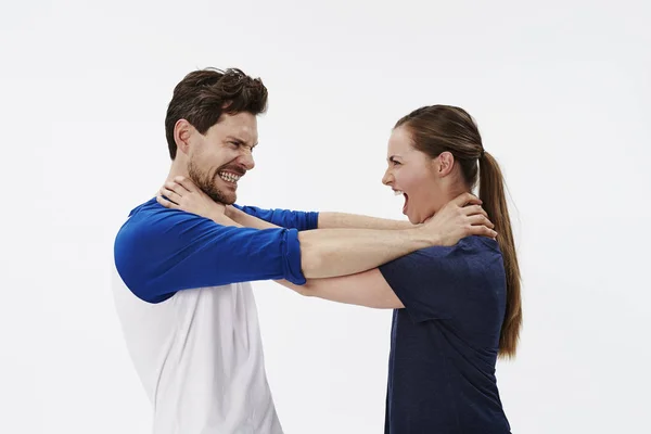 Couple strangling each other — Stock Photo, Image