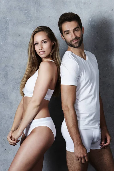 Beautiful couple in white underwear — Stock Photo, Image