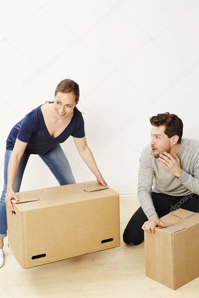 Woman lifting boxes