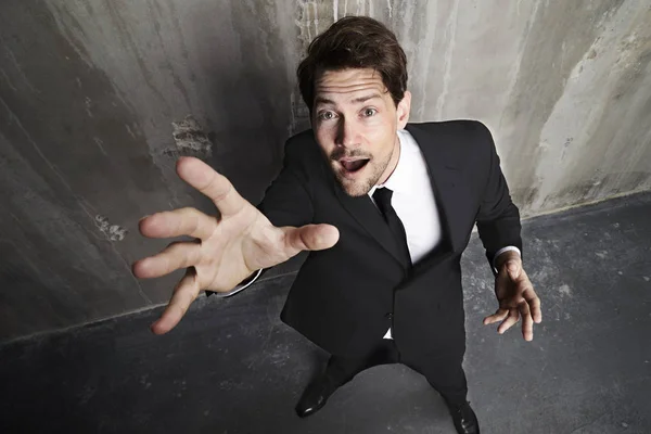 Bearded businessman reaching up — Stock Photo, Image