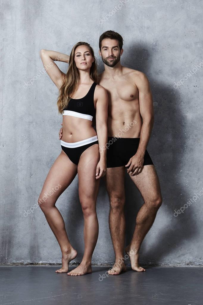 Beautiful couple posing in underwear Stock Photo by ©sanneberg 129653784