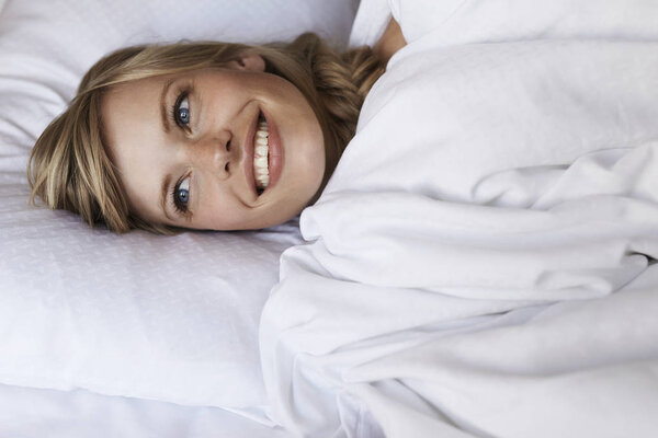 Blond woman in bed