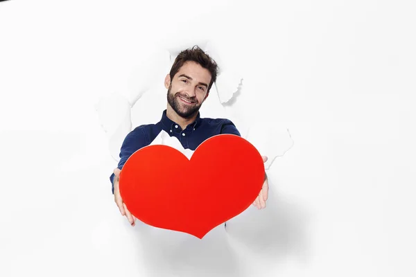 Hombre apasionado con corazón rojo —  Fotos de Stock