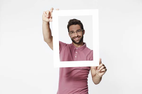 Sorridente uomo holding frame — Foto Stock