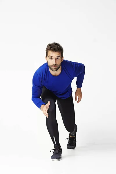 Handsome athlete ready to run — Stock Photo, Image