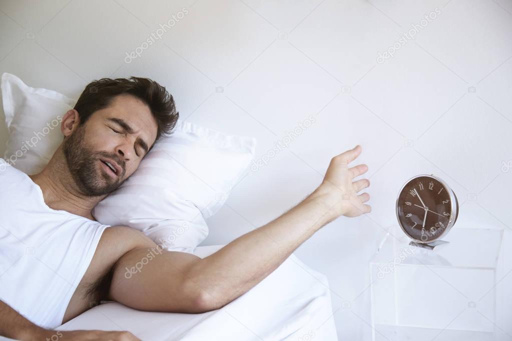 Sleeping man in bed 