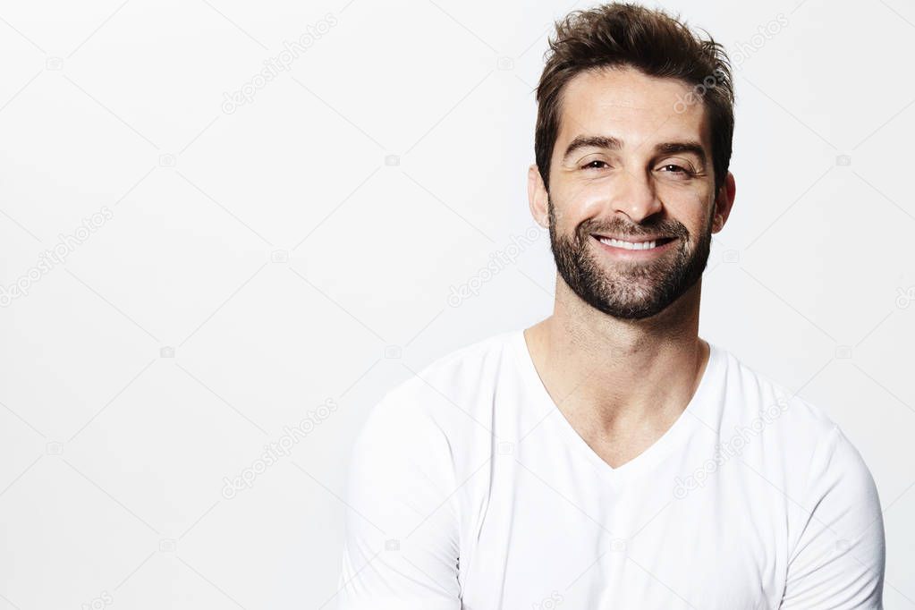 Smiling man in white t-shirt