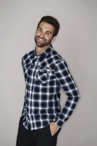 Smiling man in checkered shirt — Stock Photo, Image