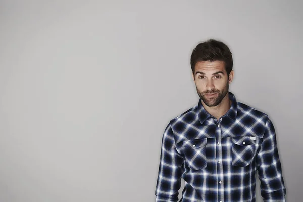 Handsome man in checkered shirt — Stock Photo, Image