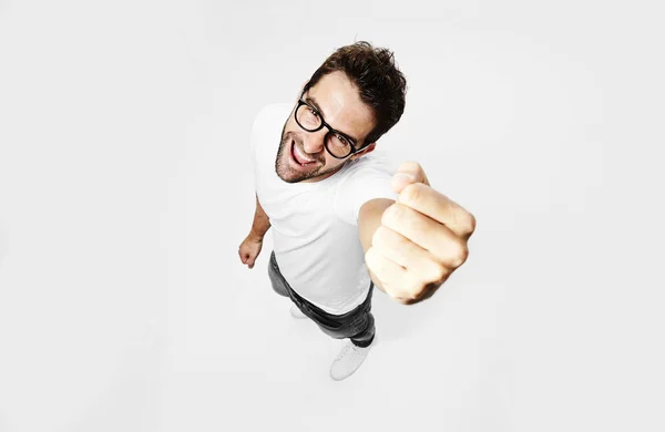 Man in eyeglasses punching air — Stock Photo, Image