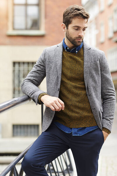 Handsome man in sweater and jacket 