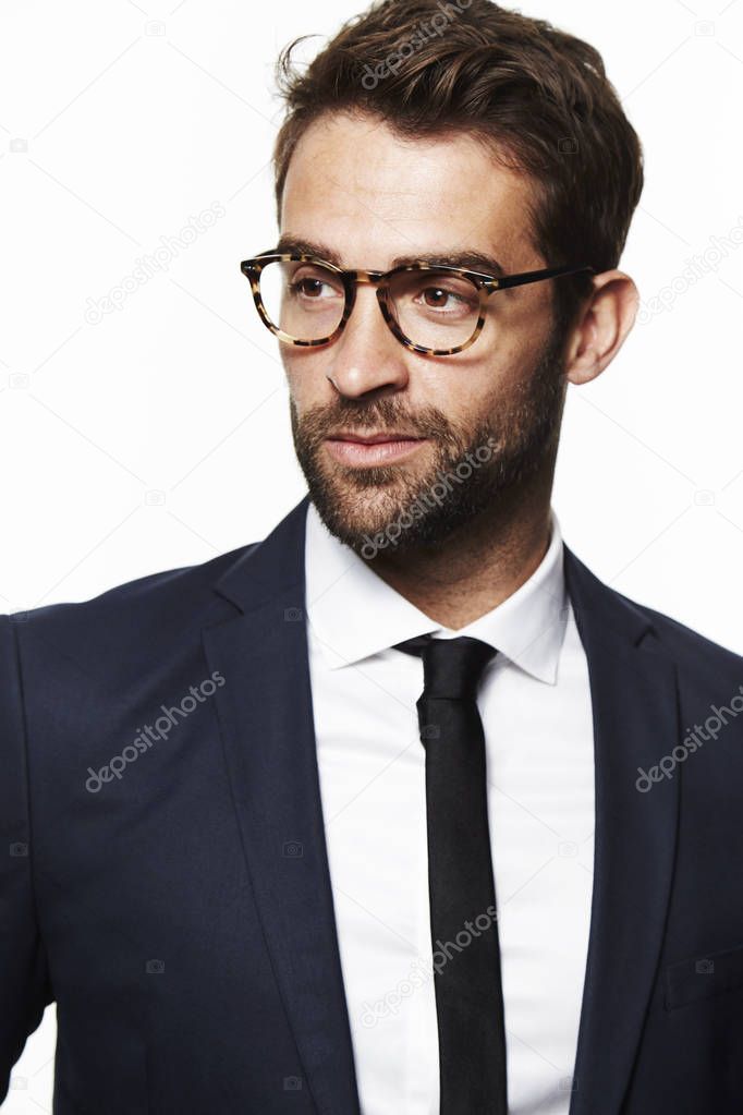 Serious man in suit and glasses