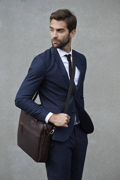Serious businessman with bag