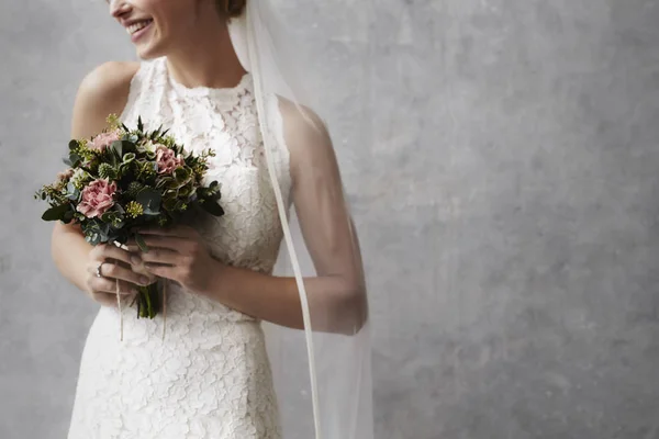 Bride holding flowers — Stock Photo, Image