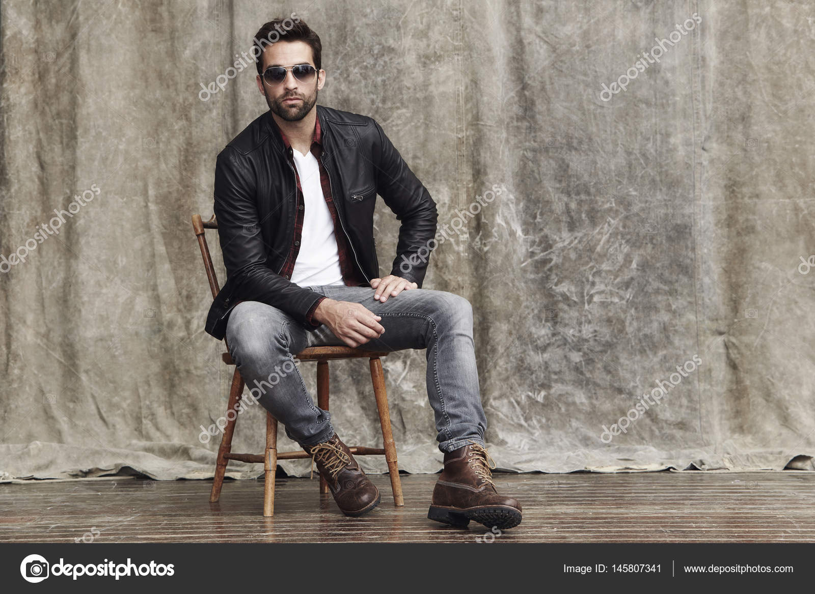 Handsome man sitting on chair hi-res stock photography and images - Alamy