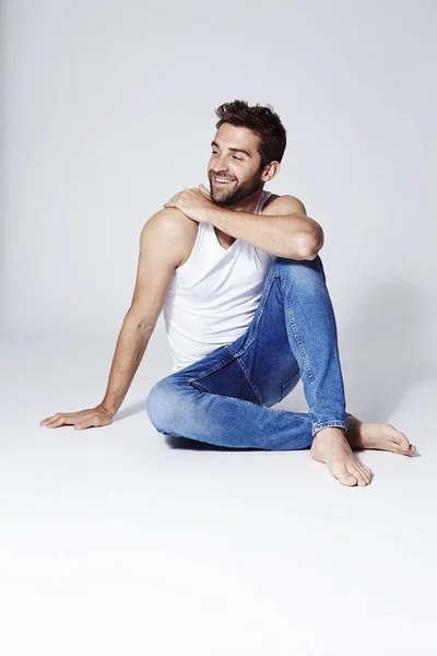 Happy guy in vest and jeans — Stock Photo, Image