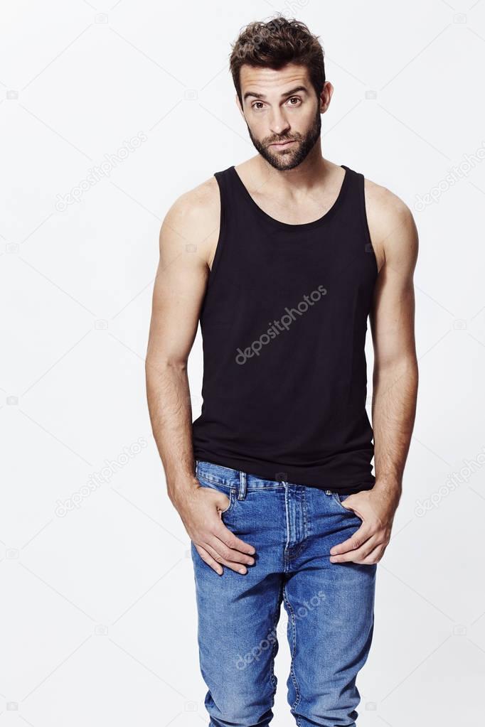 Man in black vest and jeans 