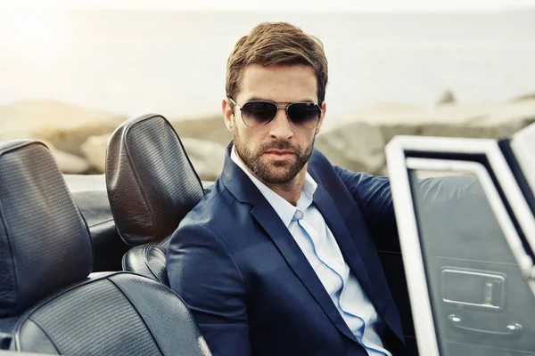Serious man in sports car — Stock Photo, Image