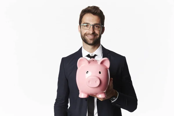 Geschäftsmann mit Sparschwein — Stockfoto