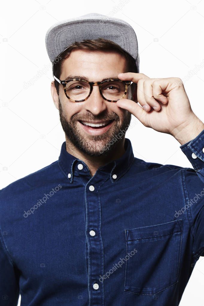 Smiling man in glasses and cap