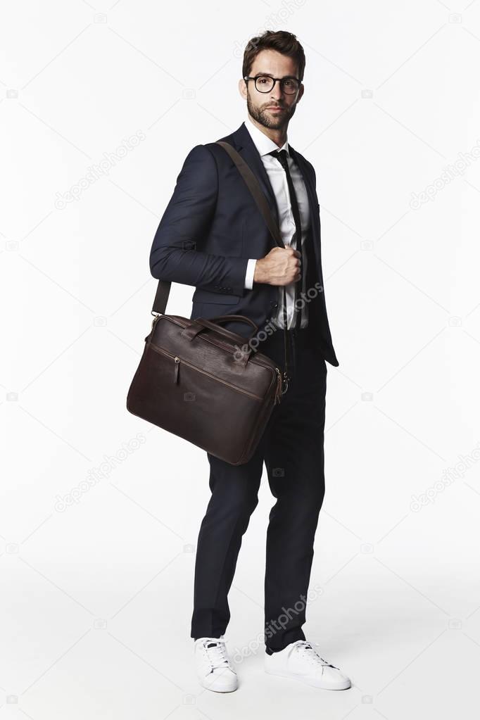 Serious businessman with bag