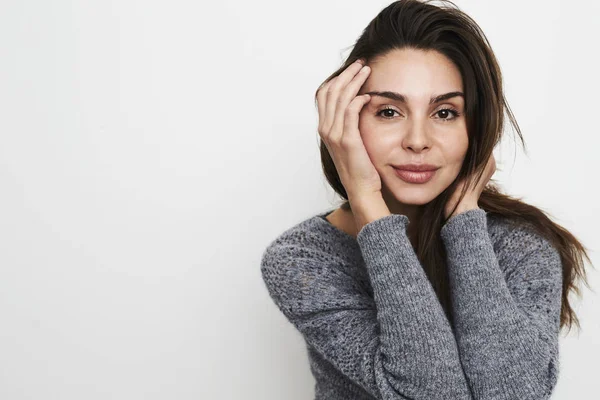Brunette woman in grey sweater — Stock Photo, Image