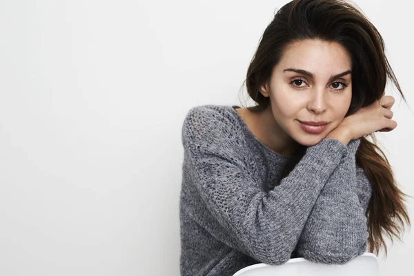 Brunette woman in grey sweater — Stock Photo, Image