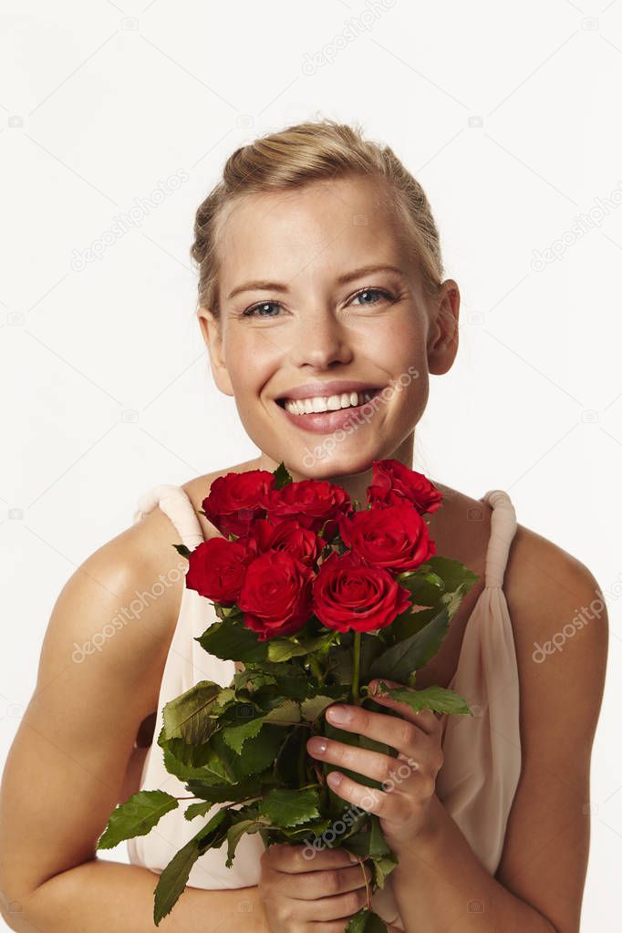 Roses held by beautiful woman