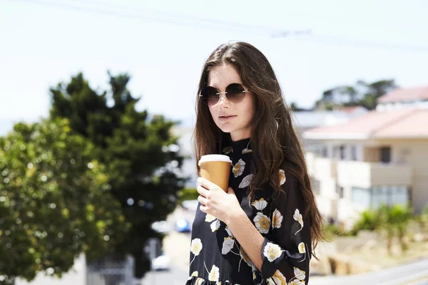 Brunette woman in floral dress — Stock Photo, Image