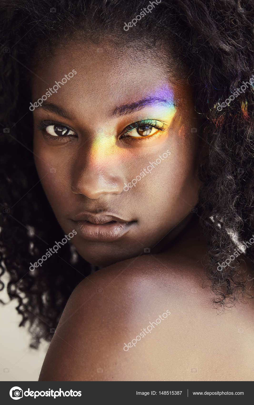 Young woman with rainbow on face Stock Photo by ©sanneberg 148515387
