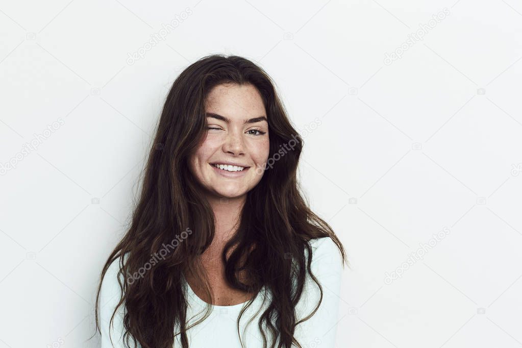 Winking woman with long hair