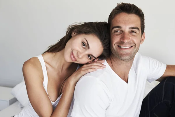 Loving couple in bedroom — Stock Photo, Image