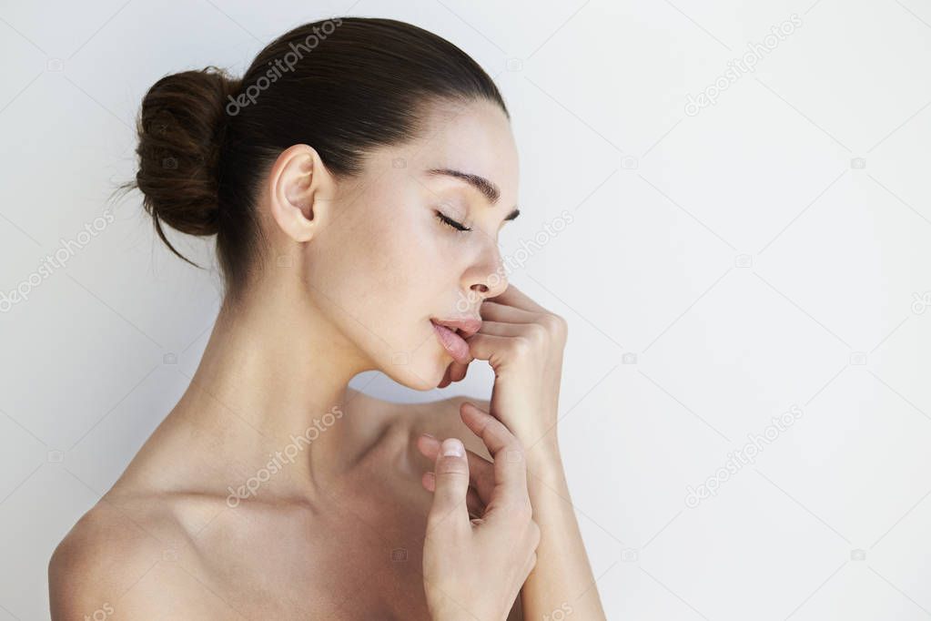 brunette woman with closed eyes 