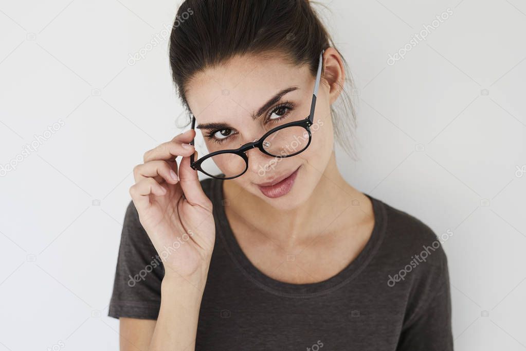 woman looking over spectacles