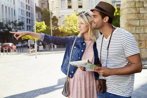 Woman pointing in city