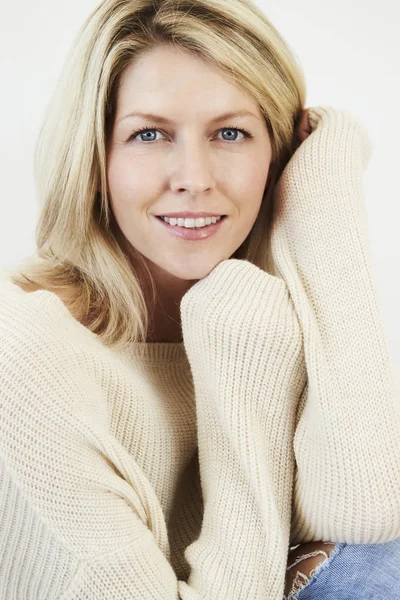 Blonde woman in knitted pullover — Stock Photo, Image