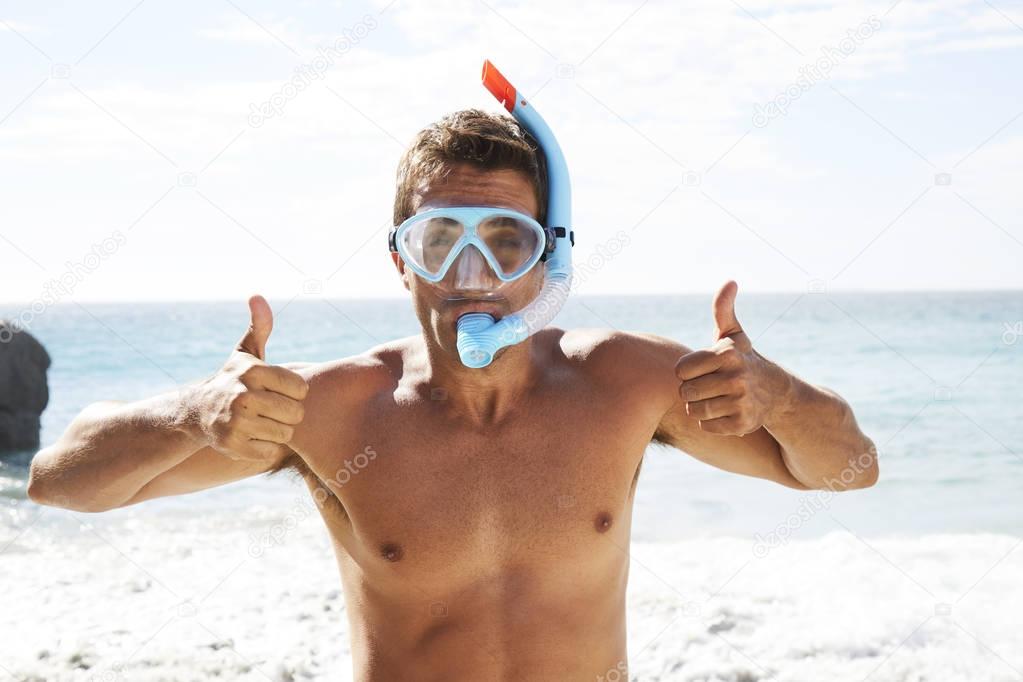 Guy in snorkel  with thumbs up