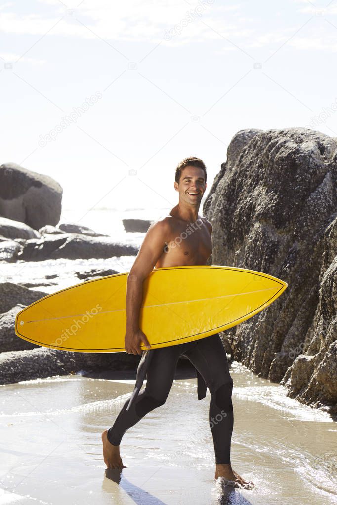 Handsome young surfer