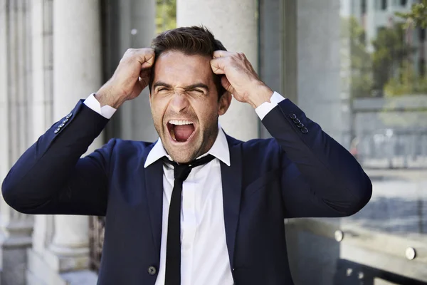 Businessman in suit shouting in rage — Stock Photo, Image