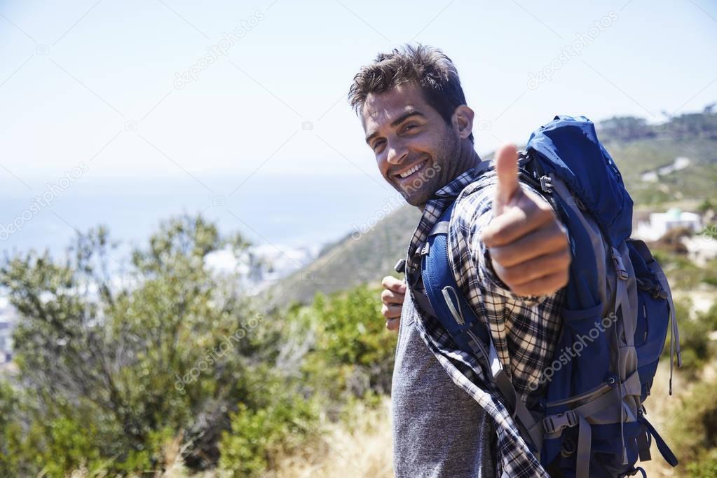 hiker with thumbs up