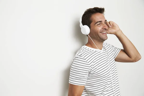 Man listening to music and daydreaming — Stock Photo, Image