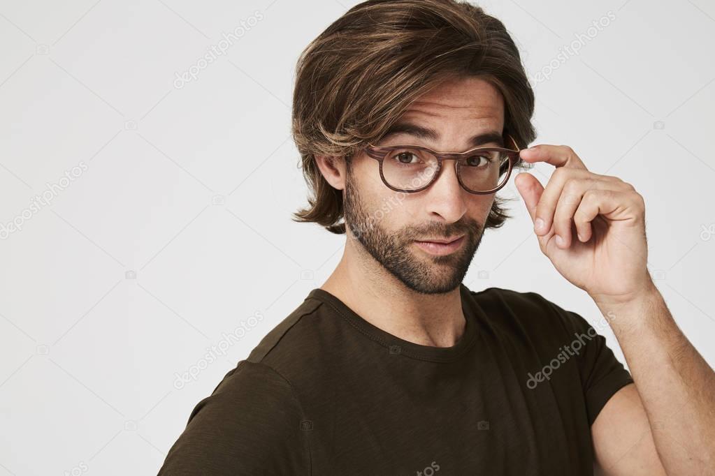 Smiling guy in t-shirt and glasses 