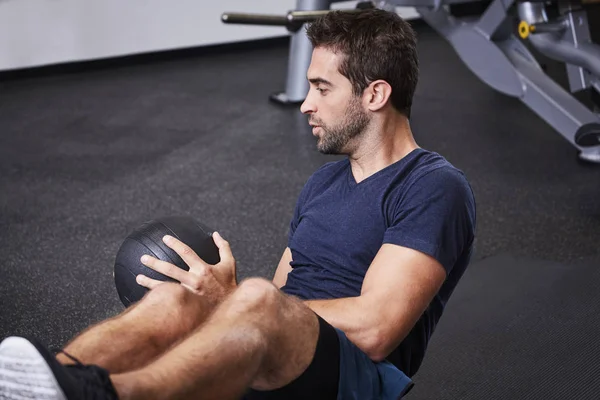 Guy using medicine ball