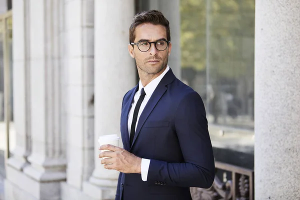 Handsome businessman holding coffee — Stock Photo, Image