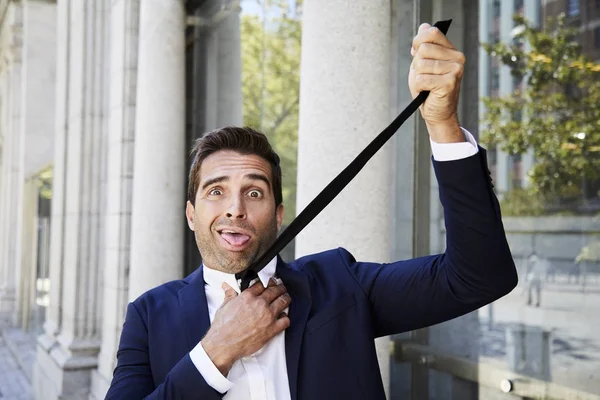 Businessman strangled by his tie — Stock Photo, Image