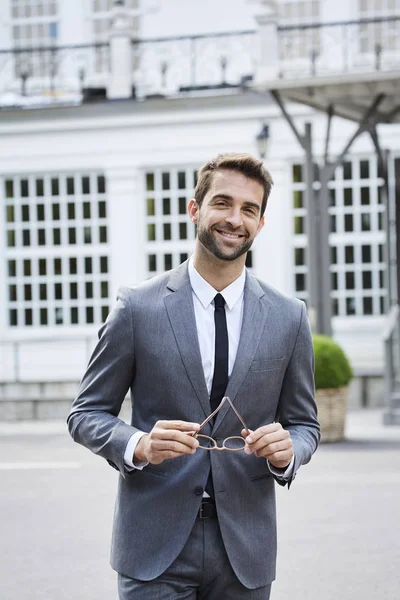 Confident business guy in grey suit — Stock Photo, Image