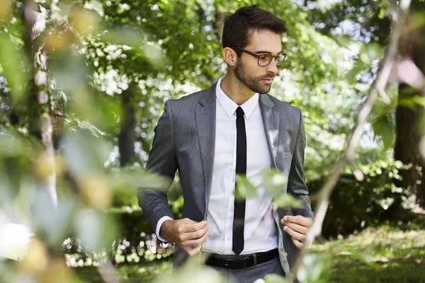 Suited guy in countryside