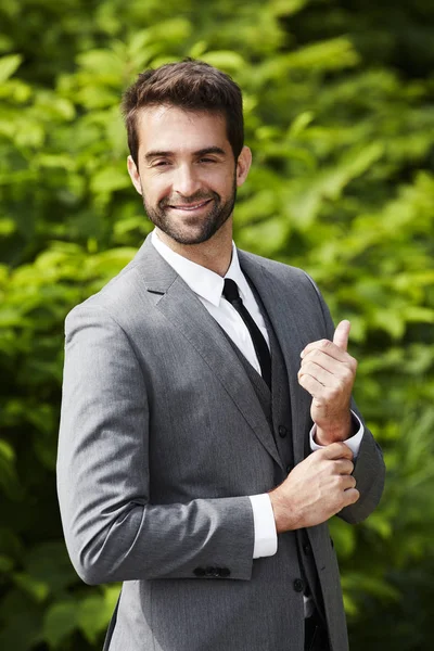 Smiling businessman in smart grey suit — Stock Photo, Image